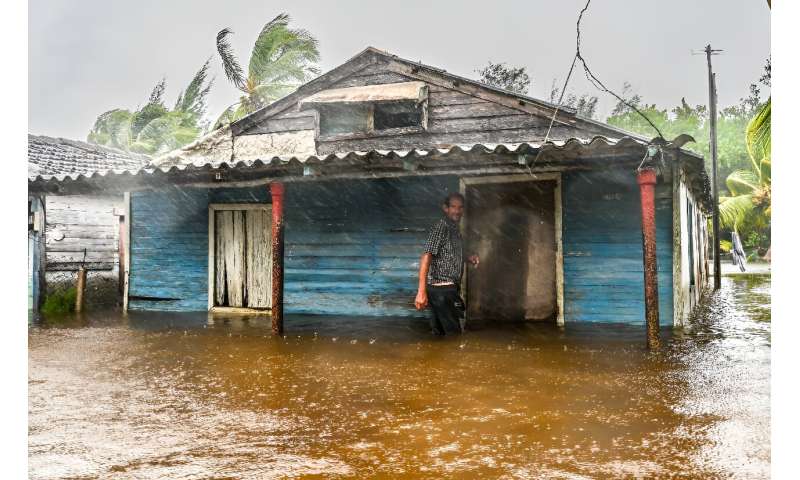 A man is seen outside his flooded house after the passage of Hurricane Helene in Guanimar, Artemisa province, Cuba, on September 25, 2024